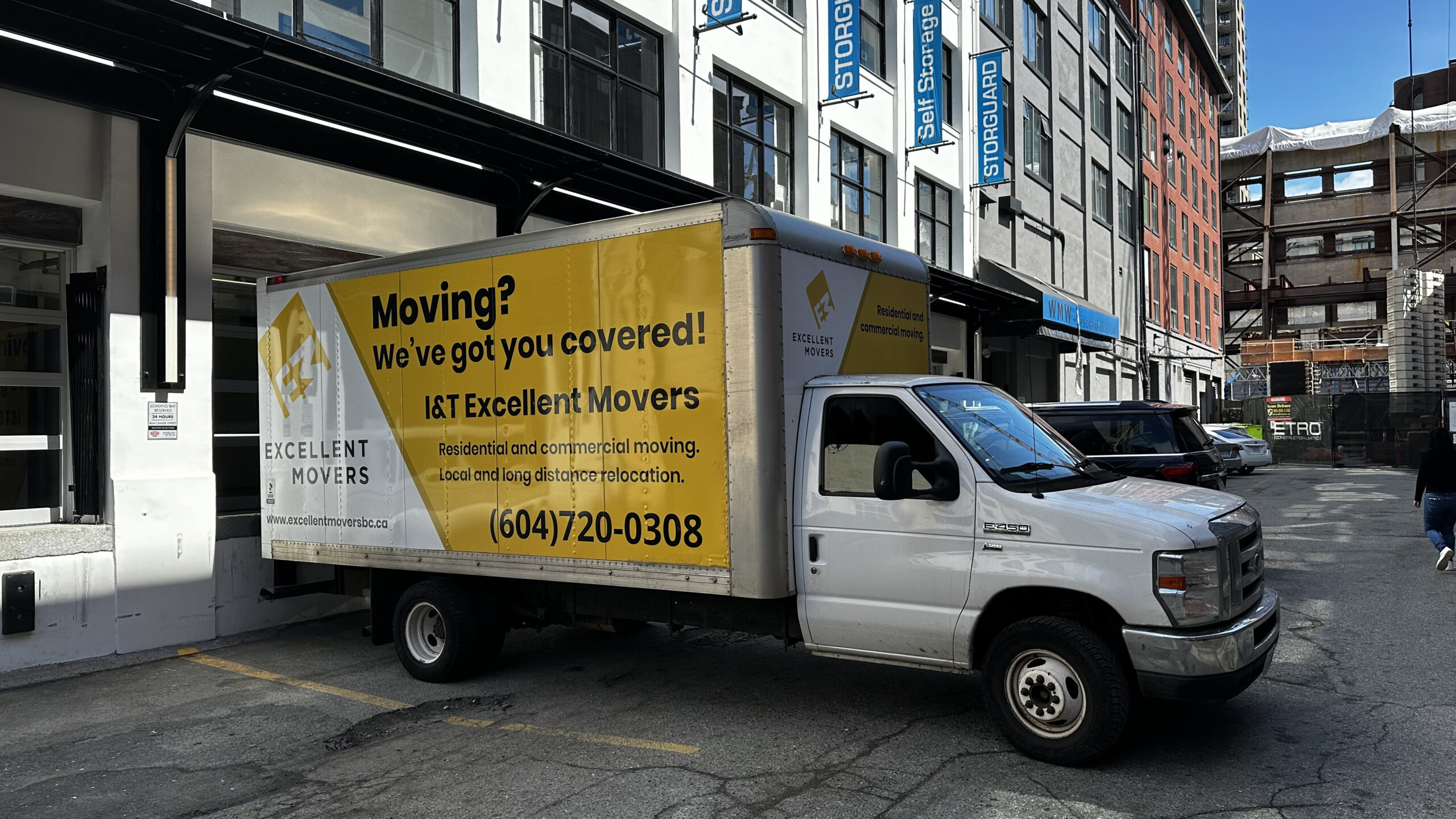 Apartment movers loading furniture at a Vancouver apartment building