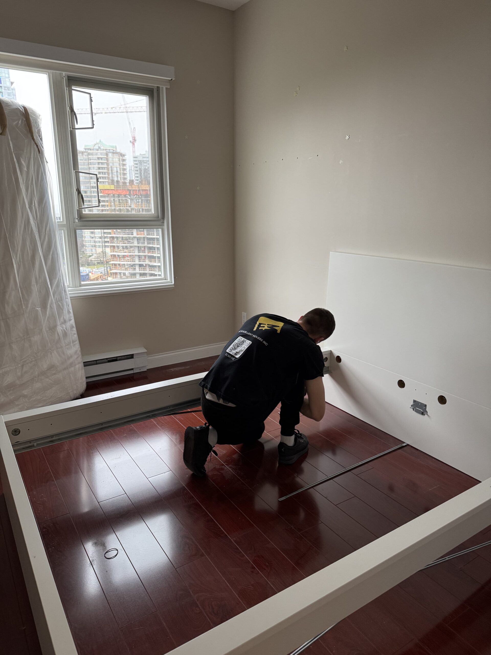 Professional movers assembling furniture during a local move in Vancouver BC